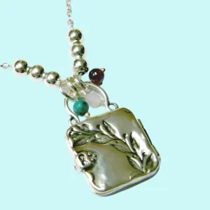 Sterling Silver necklace locket engraved with a beautiful branch with turquoise