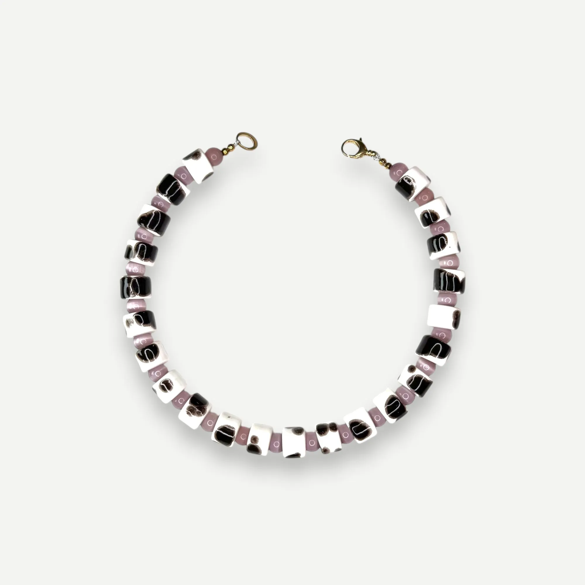 TORT & CAT EYE SUNDRY.  BEAD TWO.